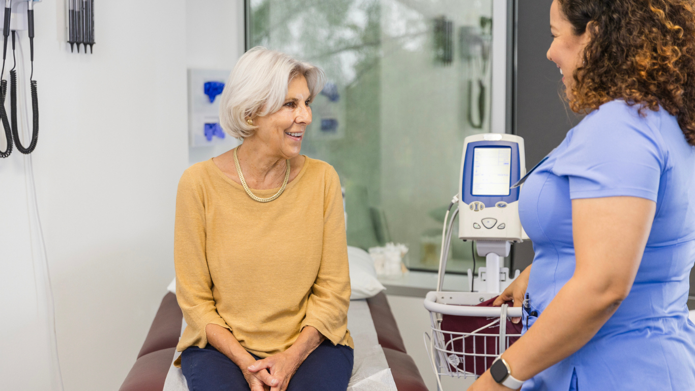 a woman talking to a nurse