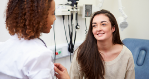 a woman talking to a doctor