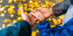 family hands together donate giving tuesday