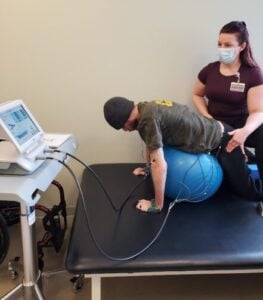 Physical Therapist using Xcite 2 Technology with a patient