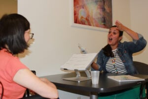 Two women engaged in conversation.